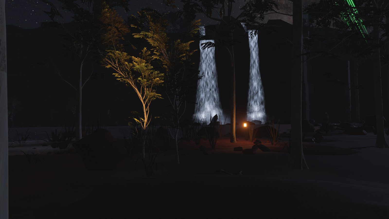 Two waterfalls coming off the sandstone escarpment into the billabong at night